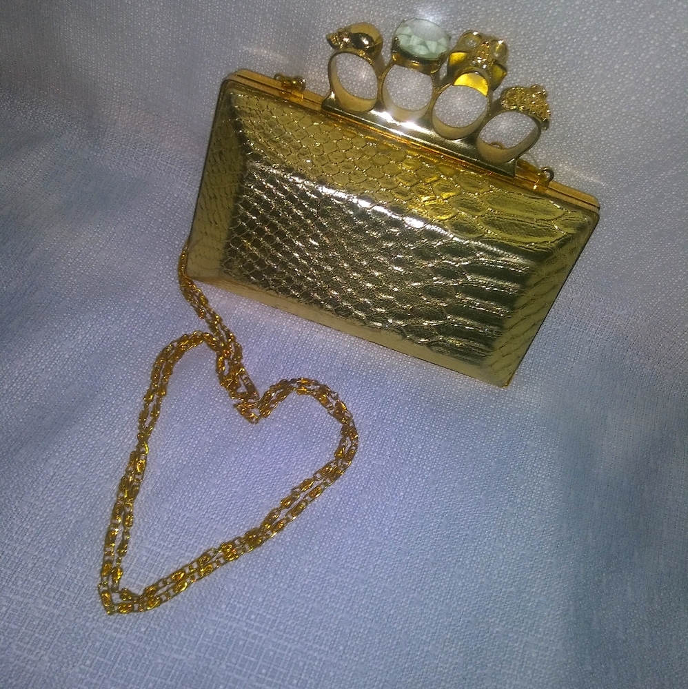 Gold skull knuckle clutch